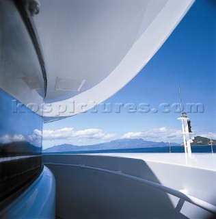 View from the bridge of a superyacht moored in a tranquil bay