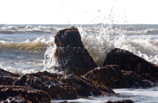 Wave crashes over rock on St Margarets Bay, Dover Kent