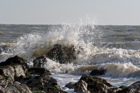 Wave crashes over rock on St Margarets Bay Dover Kent