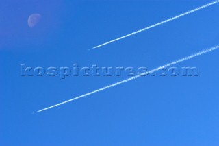 Two Jet planes in the sky with moon (Digital image moon and extra plane added)