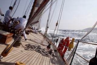 Helmsman steers classic yacht Eleanora through choppy seas at Les Voiles de Saint Tropez, France