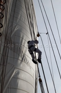 Crew member climbs aloft on board classic yacht Eleanora during the Voiles de St Tropez 2004