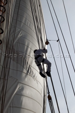 Crew member climbs aloft on board classic yacht Eleanora during the Voiles de St Tropez 2004