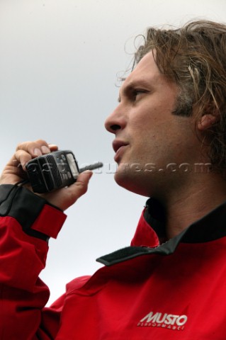 Man using an ICOM VHF handheld radio 