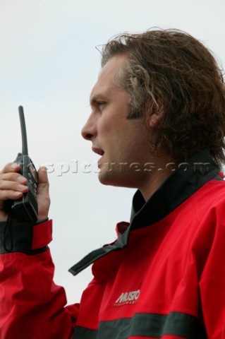 Man using an ICOM VHF handheld radio 