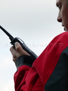 Man using an ICOM VHF handheld radio