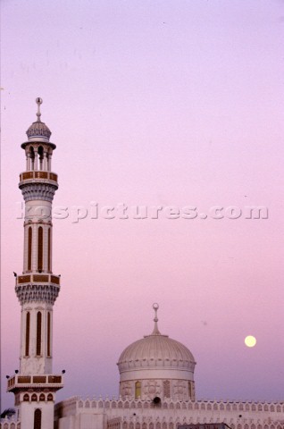 Tower of mosque at sunset Dubai  United Arab Emirates 