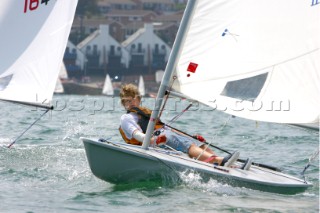 Young sailor racing a Laser dinghy