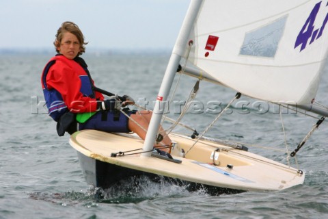 Young girl sailing Laser