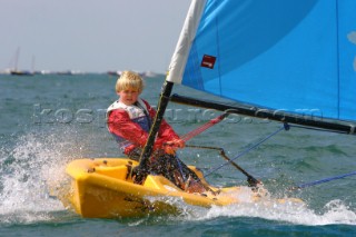 Boy sailing in choppy seas