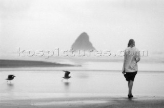 Girl walking on Keri-Keri Beach, Nr Aukland, NZ