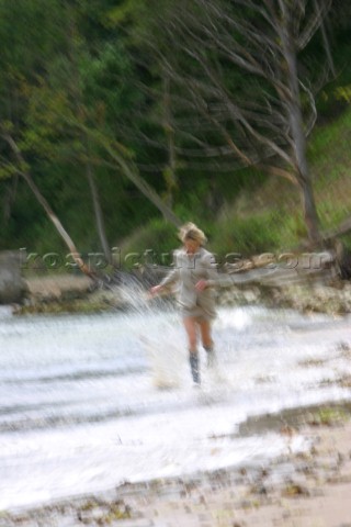 Girl running through water