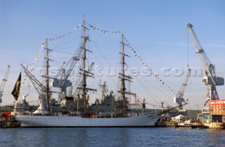 Tall ship Cisne Branco docked along side dressed in colours