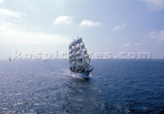 Tall ship Kersones under full sail in flat seas