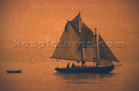 Small classic schooner with red mist effect