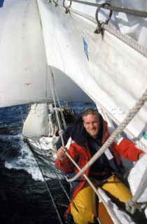 Crew member on bow sprit of tall ship Belle Poule