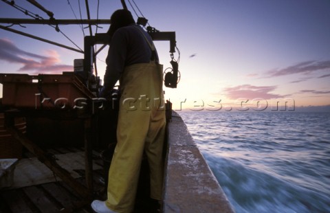 Fishermen in Solent at dawn UK