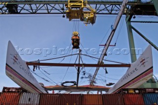 Crane lifting G Class catamaran Cayenne on to a container ship in the Port of Antwerp, Belgium