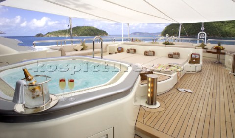 Champagne and jacuzzi on aft deck of superyacht