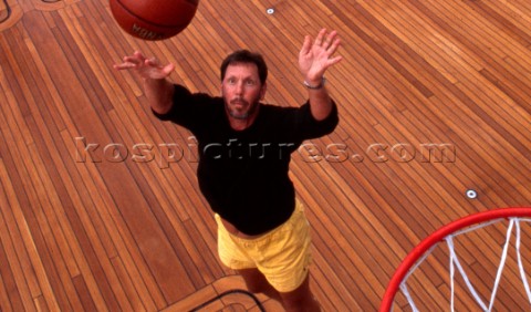 Oracle software CEO Larry Ellison playing basketball on the aft deck of his superyacht Katana