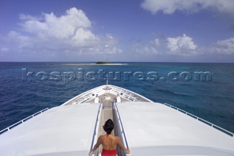 Woman on top deck of superyacht