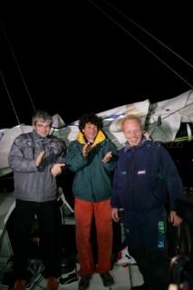 Congratulated by winner Vincent Riou of PRB and Jean Le Cam of Bonduelle, British Open 60 sailor Mike Golding of Ecover arriving in Les Sables dOlonne at the end of the Vendee Globe 2004/2005