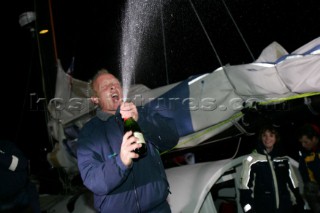 Spraying champagne in celebration. British Open 60 sailor Mike Golding of Ecover arriving in Les Sables dOlonne at the end of the Vendee Globe 2004/2005