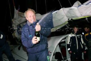 Spraying champagne in celebration. British Open 60 sailor Mike Golding of Ecover arriving in Les Sables dOlonne at the end of the Vendee Globe 2004/2005