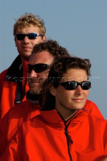 From right crew Claire Bailey, Mark Featherstone and navigator Wouter Verbraak. Team wearing sunglasses in red Musto clothing