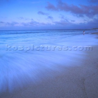 Waves lapping shore on slow shutter speed