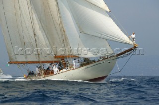 Crew member on bowsprit of classic schooner