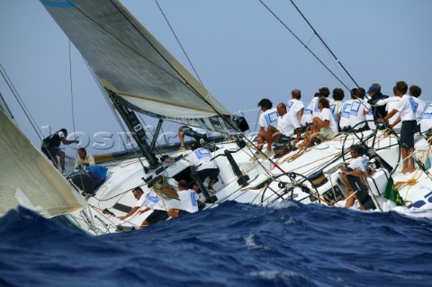 Crew on racing yacht in rough seas