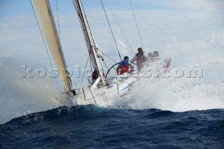 Swan yacht ploughing into big wave in rough seas