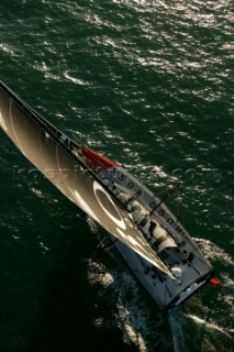 Aerial view of Open 60 sailing yacht sailing up wind