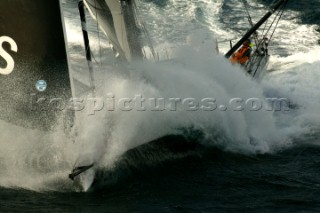Vendee Globe Open 60 yacht Hugo Boss skippered by Alex Thomson powering through rough seas in strong winds
