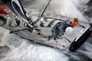 Vendee Globe Open 60 yacht Hugo Boss skippered by Alex Thomson crashing through rough seas in strong winds