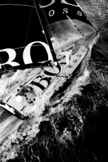 Open 60 Hugo Boss crashing through rough seas
