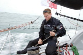 Skipper of the Open 60 Ocean yacht Alex Thomson tailing a winch