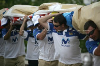 Volvo Ocean Race 2005-2006. Crew carrying the sails of Movistar - Volvo 70 Canting ballast swing keel