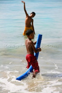 Tortola Island - British Virgin Islands - . Cane Garden Bay -. Local Children playing with the water