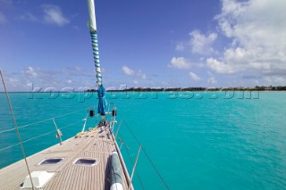 Sailing yacht at anchor in clear blue Caribbean water