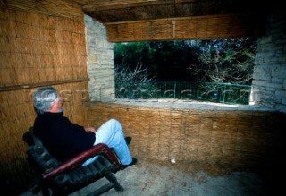 Man sitting in observation point in same chair used by Tito, Brijoni Islands, Croatia