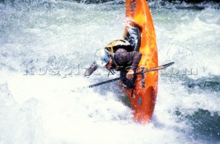 Canoeist negotiates rapids on the Zambezi River, Zambia