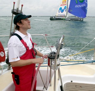 Duran Duran star Simon Le Bon at the helm of maxi yacht Arnold Clarke Drum at the start of the Rolex Fastnet Race 2005