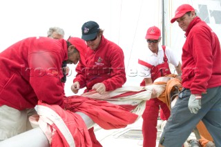 Simon Le Bon and crew on maxi yacht Arnold Clarke Drum prepare the spinnaker for hoisting