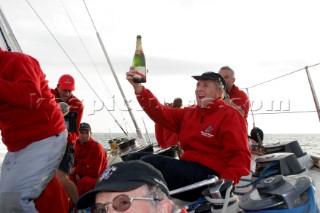 Crew onboard the maxi yacht Drum during the Fastnet of 2005, celebrate passing the point they capsized 20 years earlier.