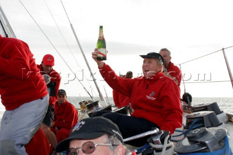 Crew onboard the maxi yacht Drum during the Fastnet of 2005 celebrate passing the point they capsize