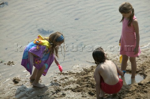 Kids children and family playing on a sandy beach