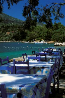 Tables and chairs at restaurant on the beach, Vathy, Ithaca, Ionian Islands