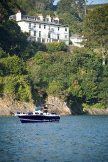 Man fishing from power boat in Dartmouth